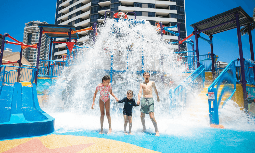 Kids playing in front of a waterpark at Paradise Resort