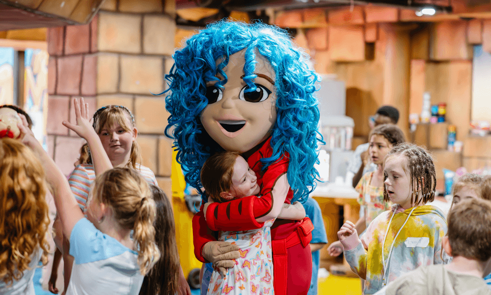 Children playing at Paradise Resort's kids club with Holly Holiday Character