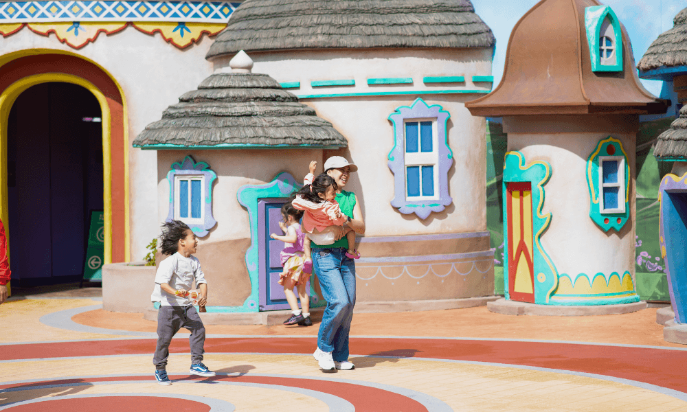 Kids running around playing with parents at Movie World Gold Coast