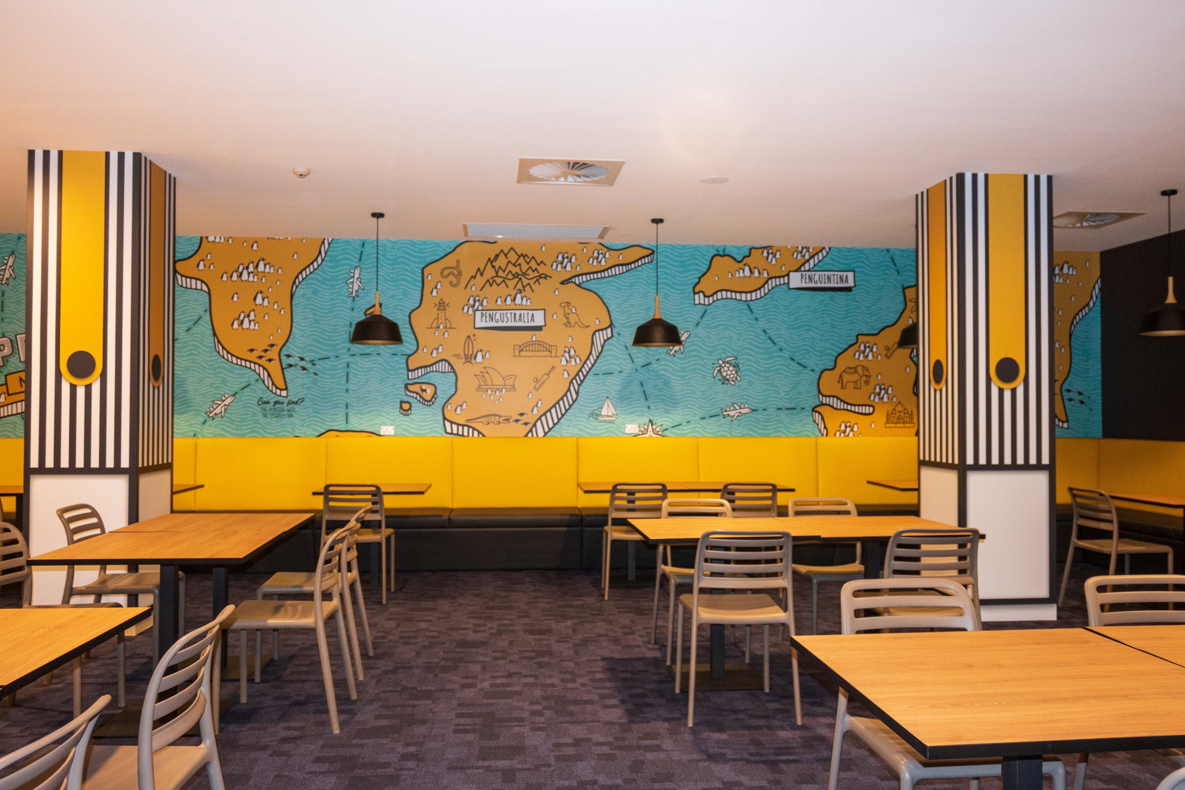 Tables and chairs inside Penguins Restaurant